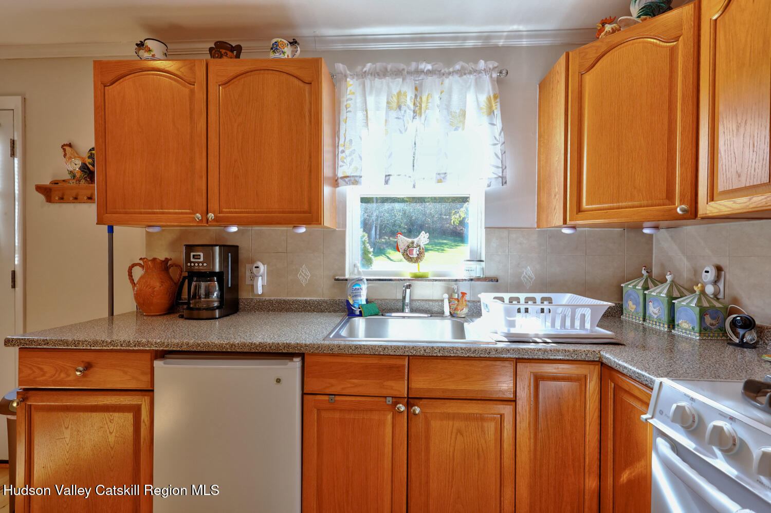 626 Bross Street Cairo, NY 12413 - Photo 23 of 78 a kitchen with stainless steel appliances granite countertop a sink a refrigerator and cabinets