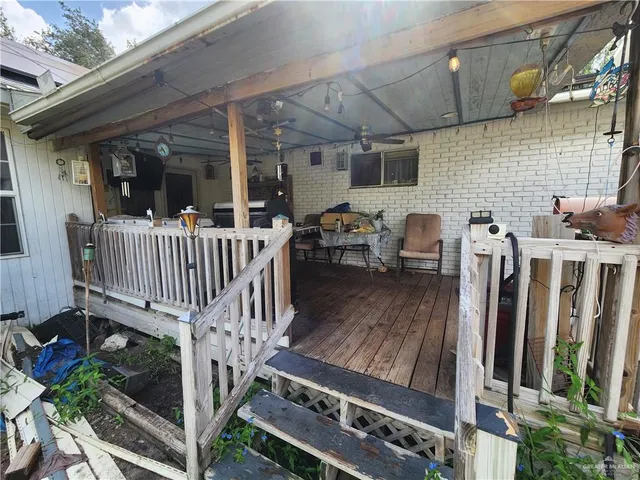 a view of a deck with furniture