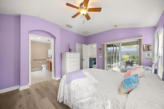 a bed room with a bed and a chandelier