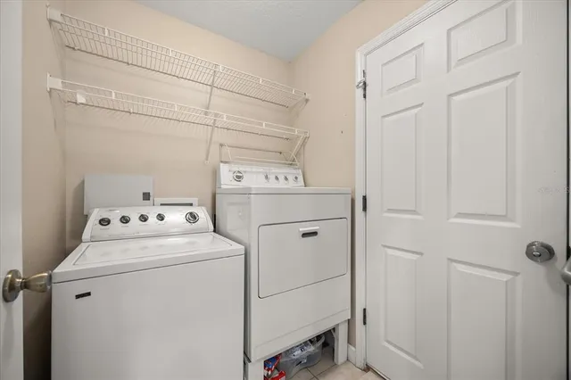 a utility room with dryer and washer