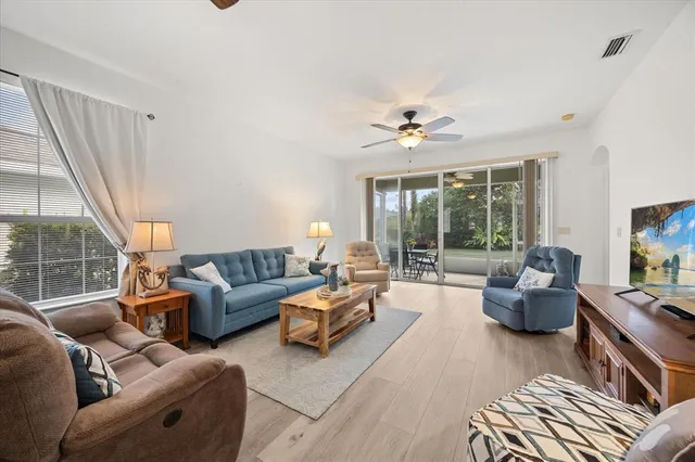 a living room with furniture and a large window