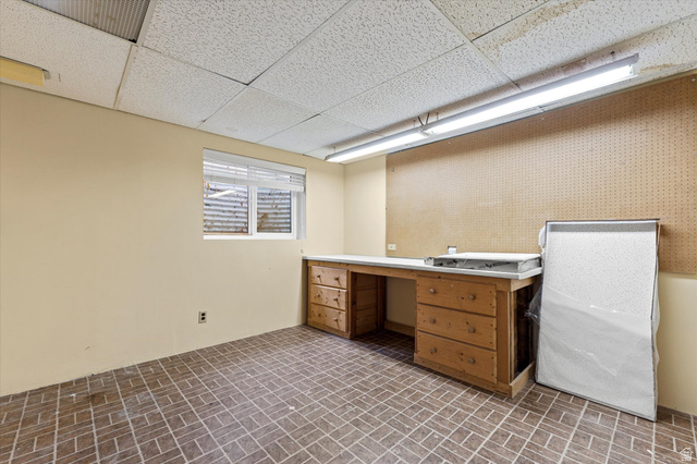 888 East 6895 South Midvale, UT 84047 - Photo 35 of 54 Dedicated workspace with built-in counters, cabinetry, and overhead lighting, perfect for projects, storage, or hobbies.