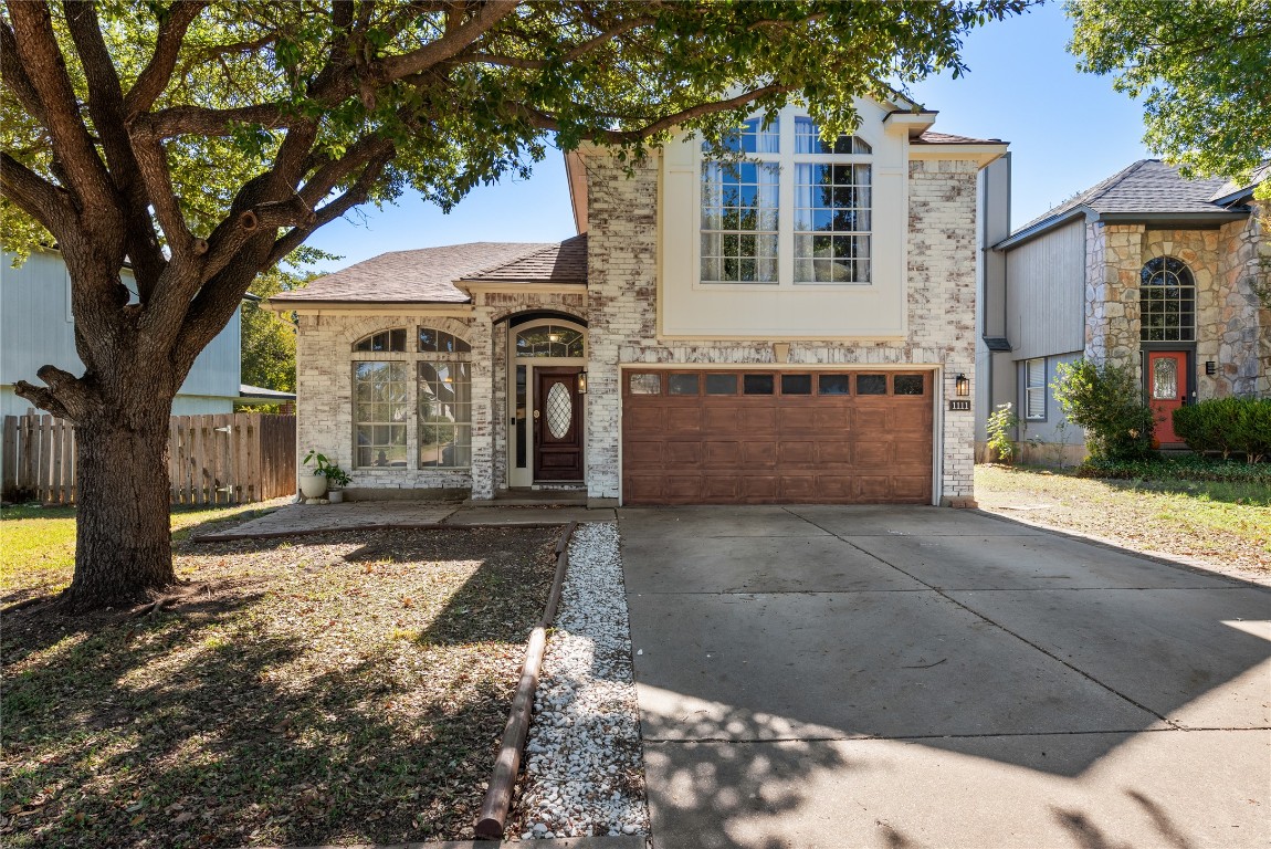 1111 Pathfinder Way Round Rock, TX 78665 - Photo 1 of 40 a front view of a house with a yard and garage