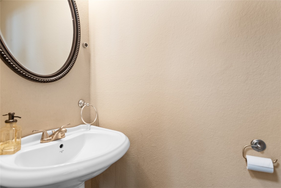 1111 Pathfinder Way Round Rock, TX 78665 - Photo 26 of 40 a bathroom with a sink and a mirror