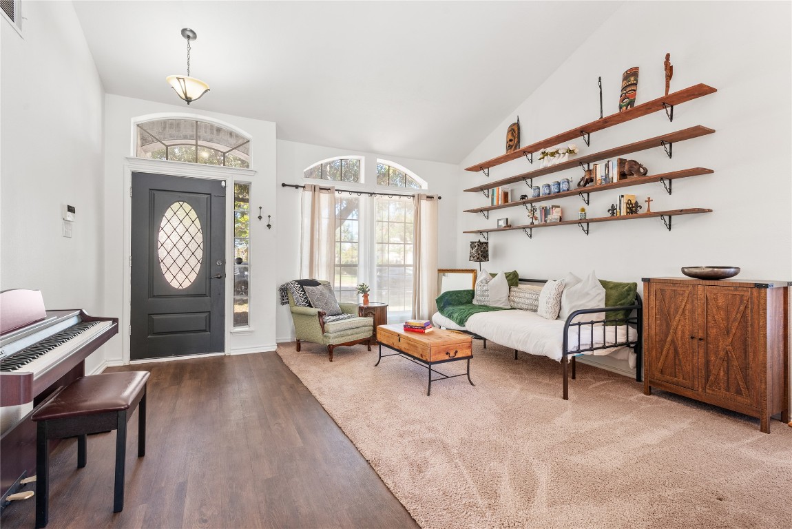 1111 Pathfinder Way Round Rock, TX 78665 - Photo 3 of 40 a living room with furniture a rug and a clock