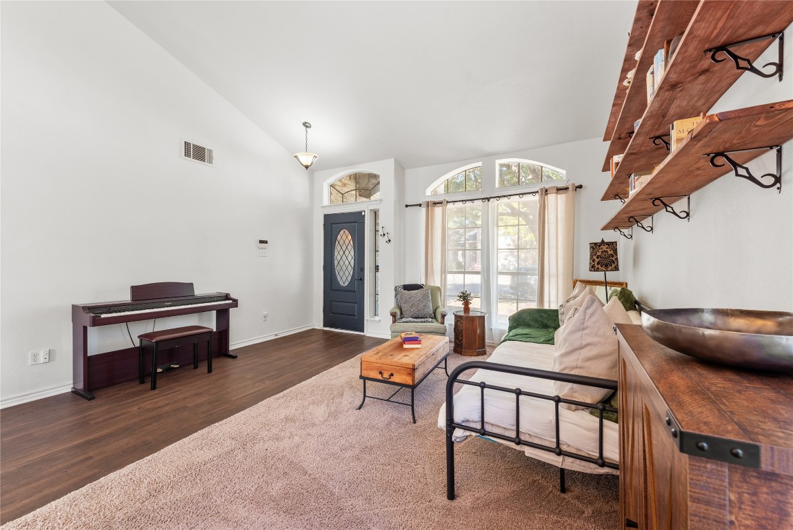 1111 Pathfinder Way Round Rock, TX 78665 - Photo 6 of 40 a living room with furniture a table and a potted plant