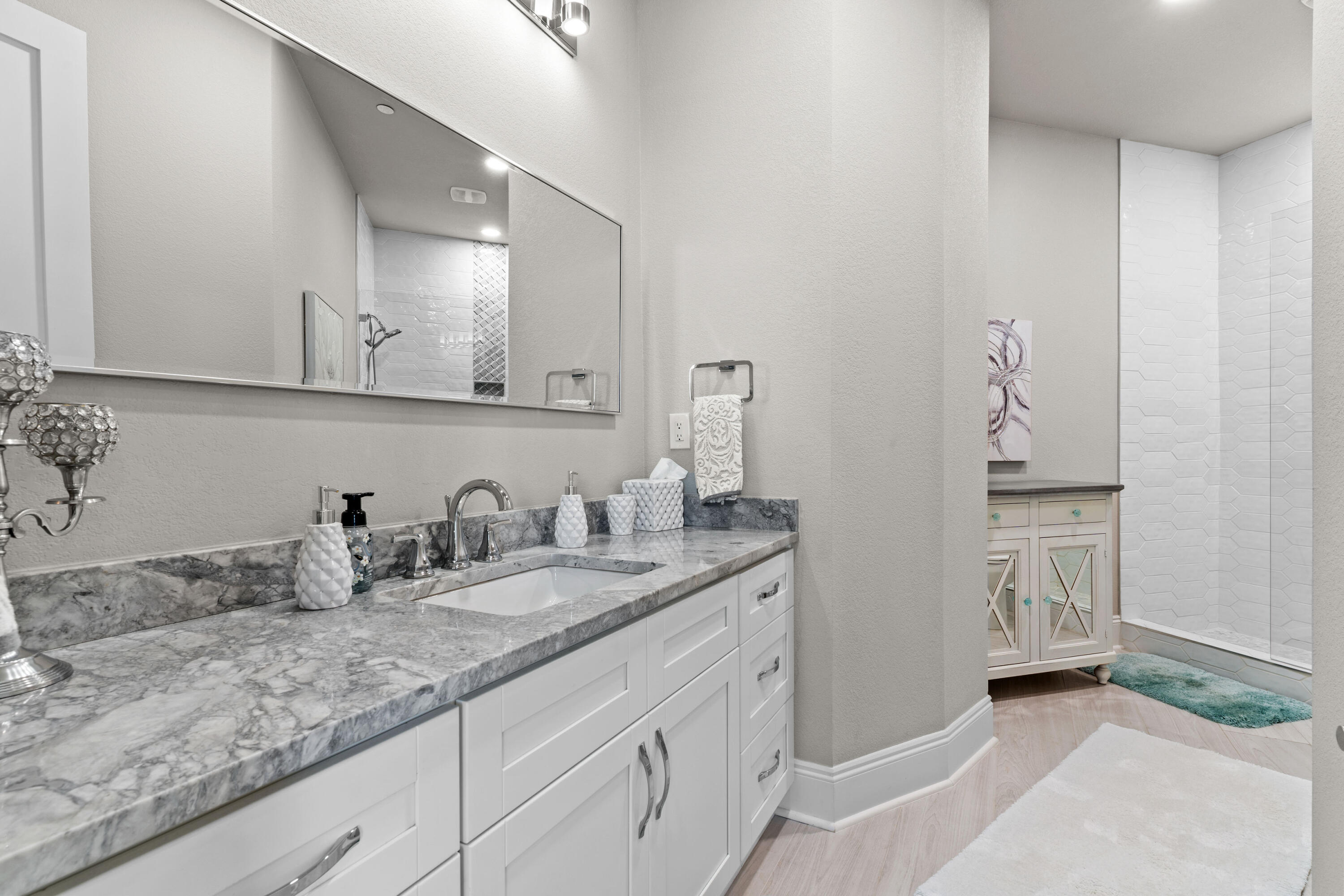 320 Harbor Boulevard, Unit 1201 Destin, FL 32541 - Photo 28 of 86 a bathroom with a sink and a mirror