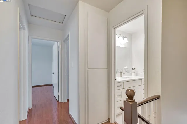 a view of a bathroom from a hallway