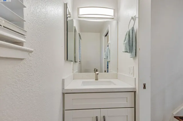 a view of a house with wooden fence