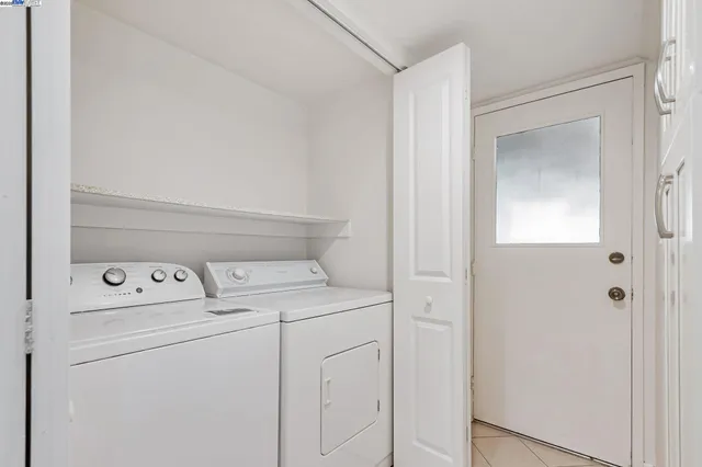 a utility room with washer and dryer