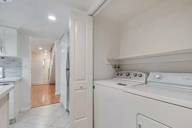 a outdoor space with patio lots of furniture and white walls