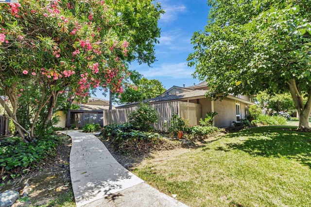 a bedroom with bed and a potted plant