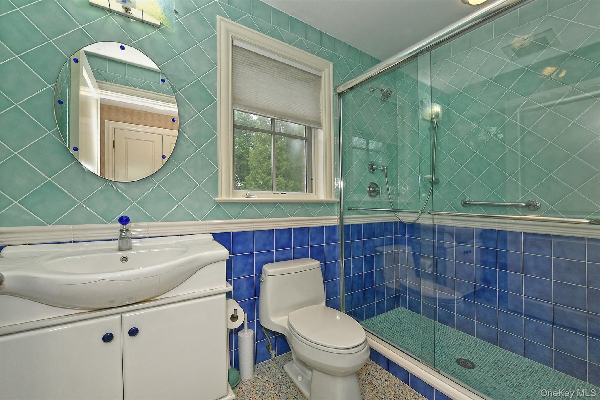14 Norgate Road Glen Head, NY 11545 - Photo 35 of 44 a bathroom with a sink a toilet and mirror