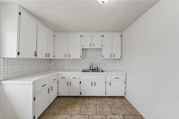 a view of kitchen with cabinets