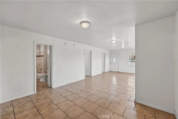 a view of an empty room and window