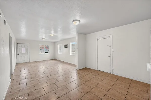 a large white kitchen with a sink