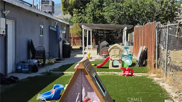 a view of yard with swimming pool