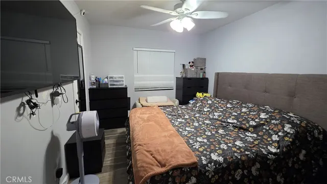 a bedroom with a bed and dresser