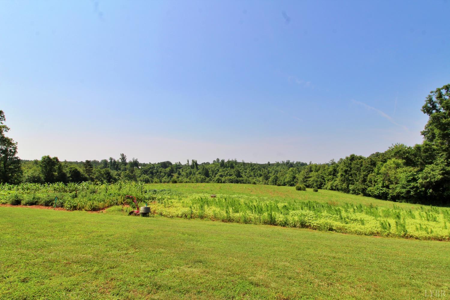 a view of a field with an ocean view