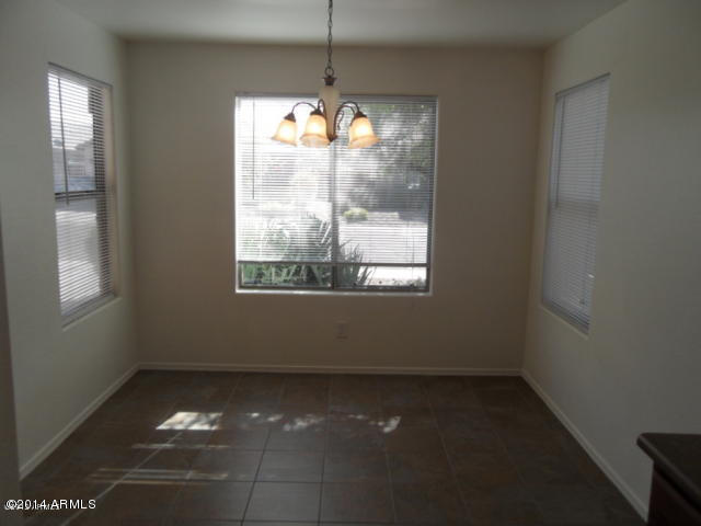 4510 West Carson Road Laveen, AZ 85339 - Photo 2 of 9 a view of an empty room with a window