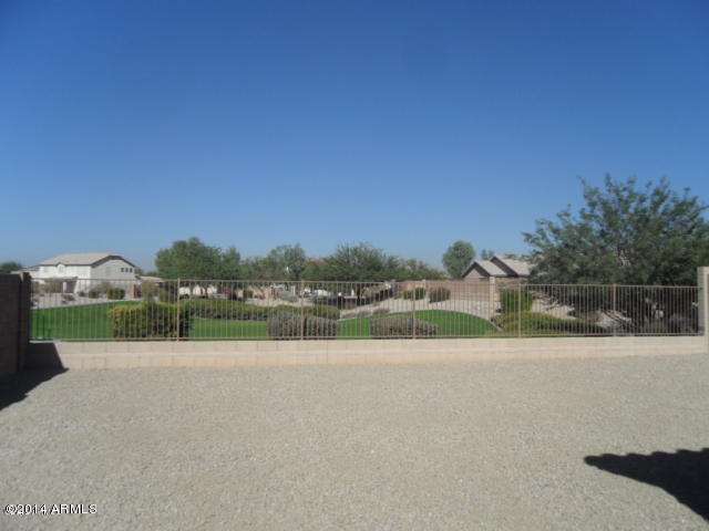 4510 West Carson Road Laveen, AZ 85339 - Photo 8 of 9 a view of a lake with houses in the background