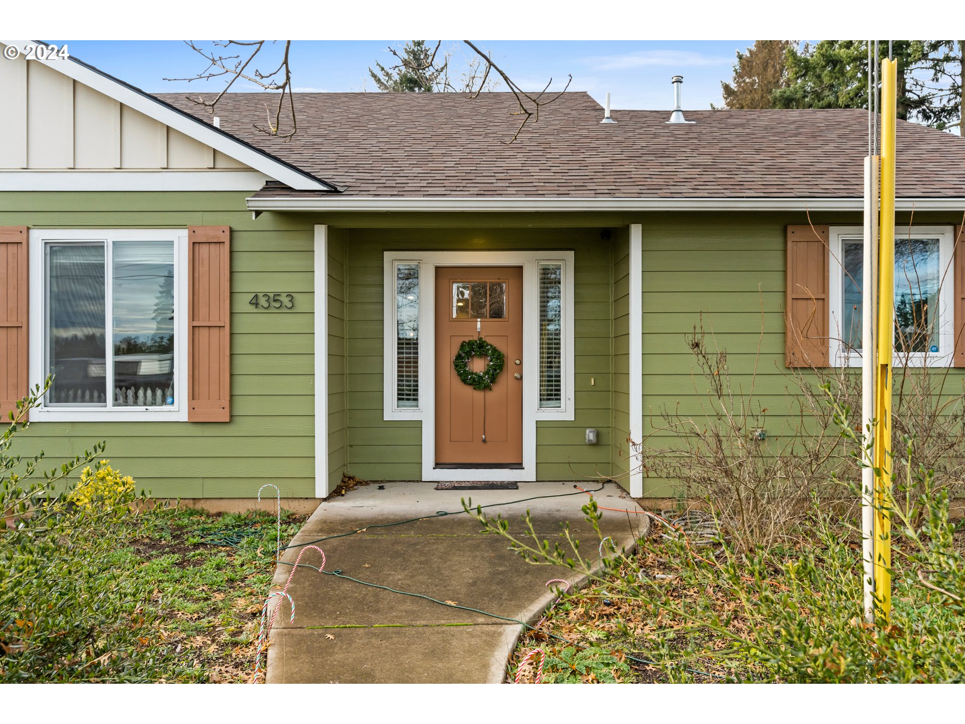 4353 Liberty Road South Salem, OR 97302 - Photo 3 of 25 a front view of a house with a garden
