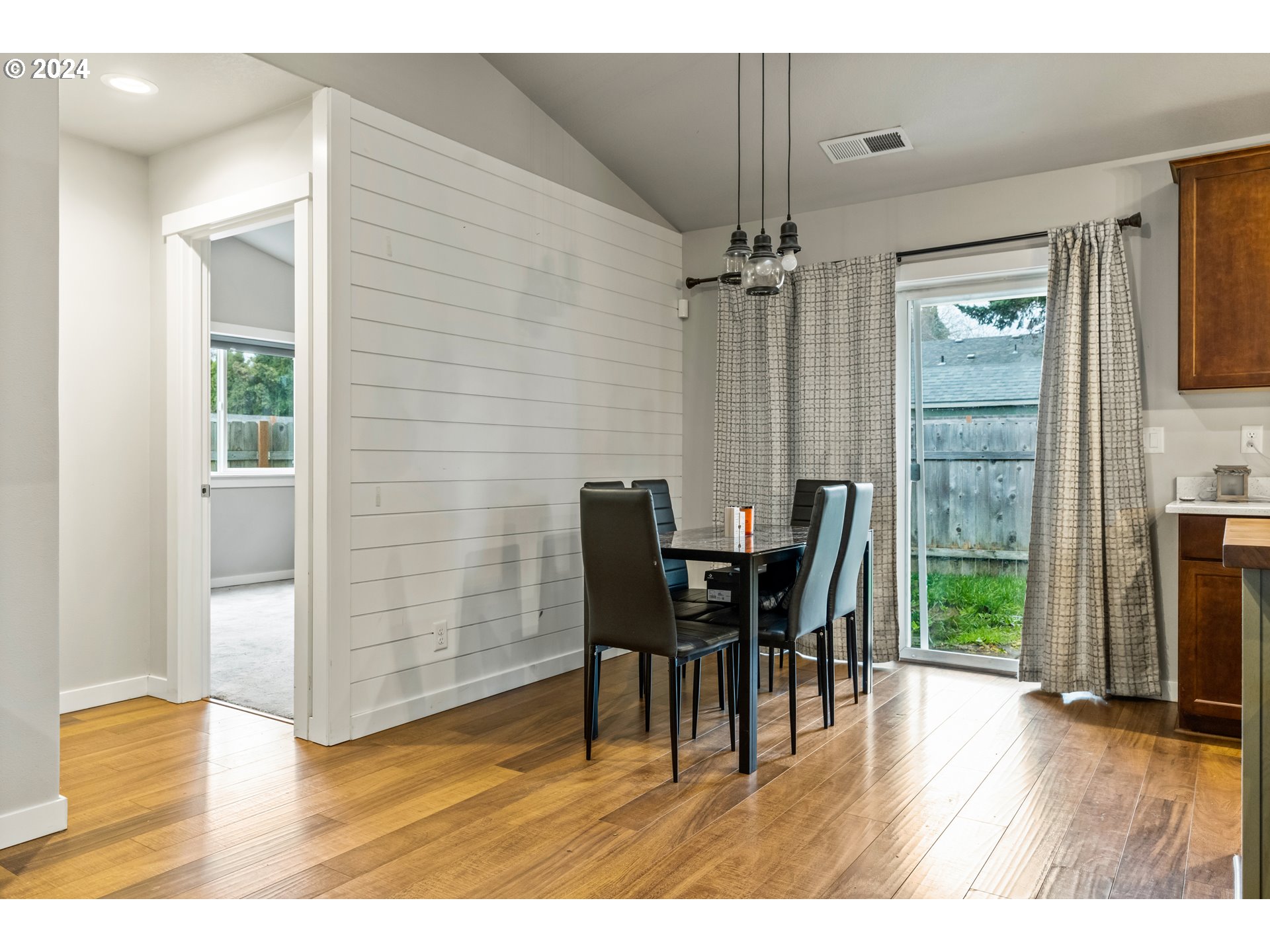 4353 Liberty Road South Salem, OR 97302 - Photo 10 of 25 a view of a dining room with furniture and wooden floor