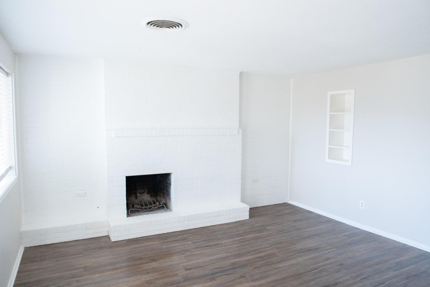 5522 13th Street, Unit A Lubbock, TX 79416 - Photo 3 of 11 a view of a livingroom with wooden floor