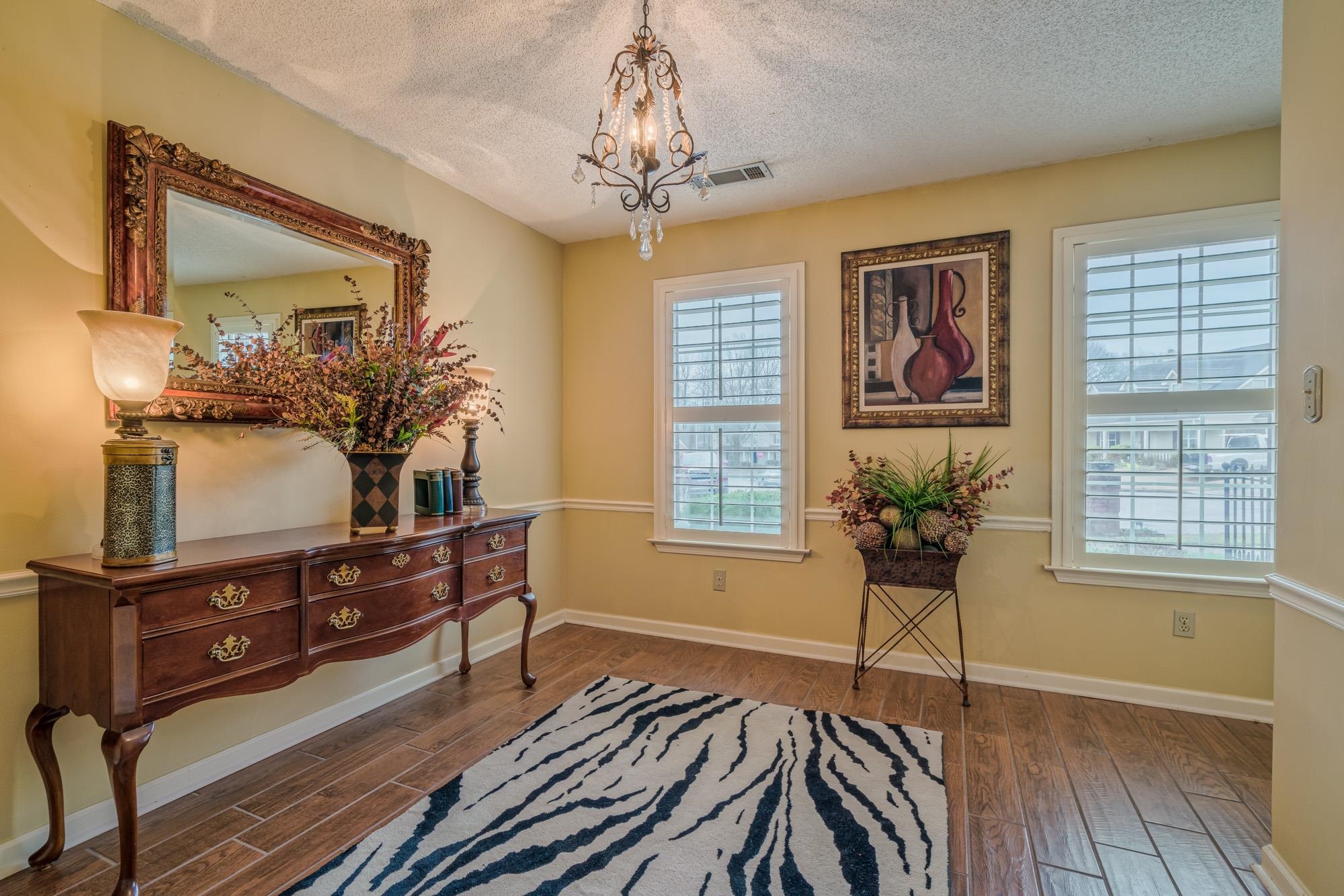 256 Windy Ridge Cove Collierville, TN 38017 - Photo 17 of 25 a living room with furniture and a flat screen tv