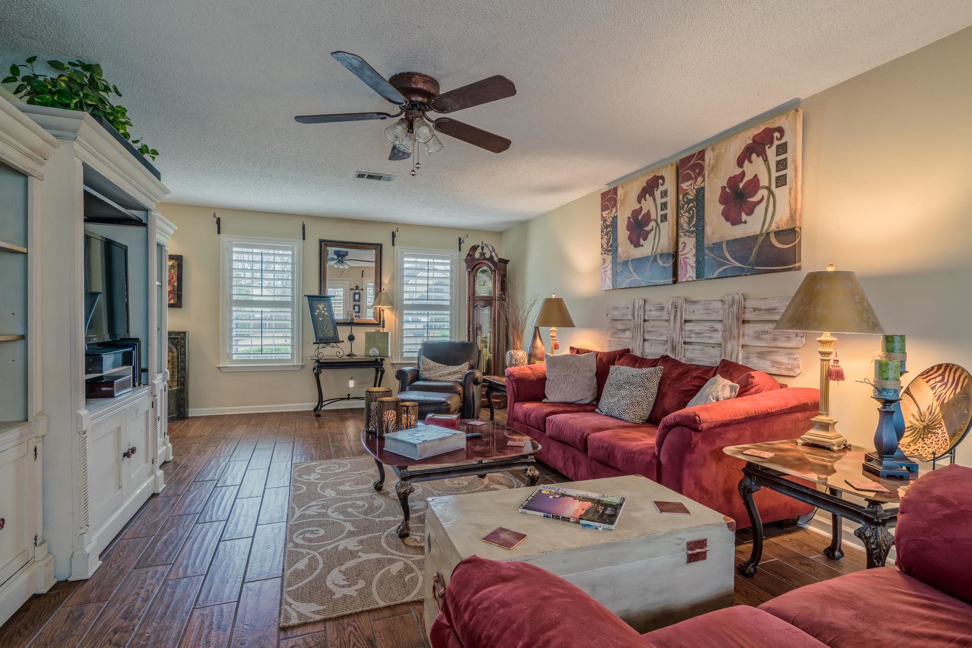 256 Windy Ridge Cove Collierville, TN 38017 - Photo 6 of 25 a living room with furniture and a wooden floor