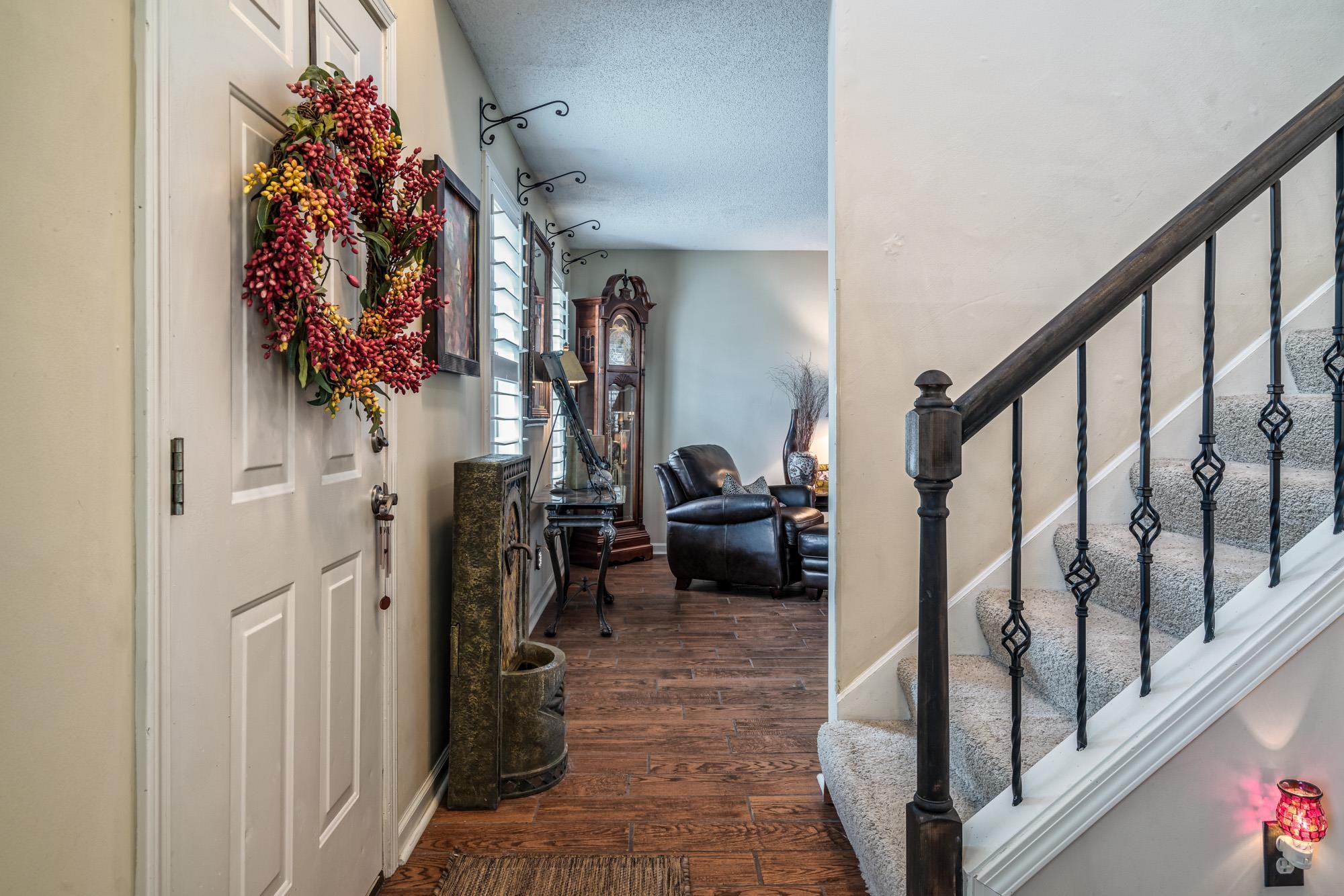256 Windy Ridge Cove Collierville, TN 38017 - Photo 10 of 25 a view of a hallway with living room and furniture