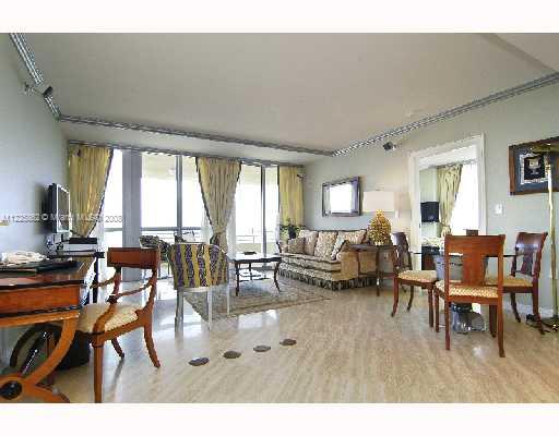101 Ocean Drive, Unit 807 Miami Beach, FL 33139 - Photo 3 of 8 a living room with furniture and a large window