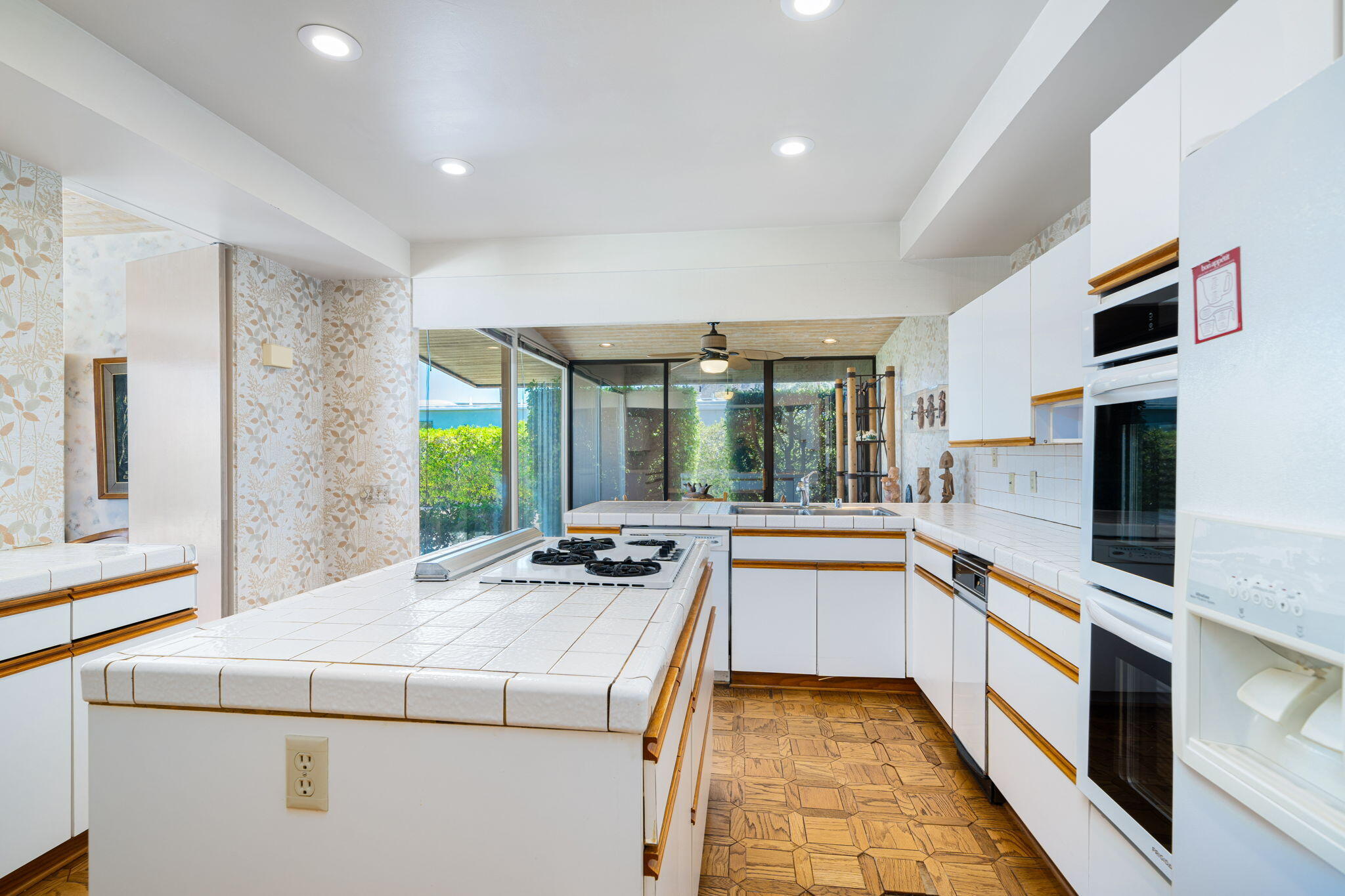 70465 Pecos Road Rancho Mirage, CA 92270 - Photo 23 of 48 a kitchen with sink stove and refrigerator