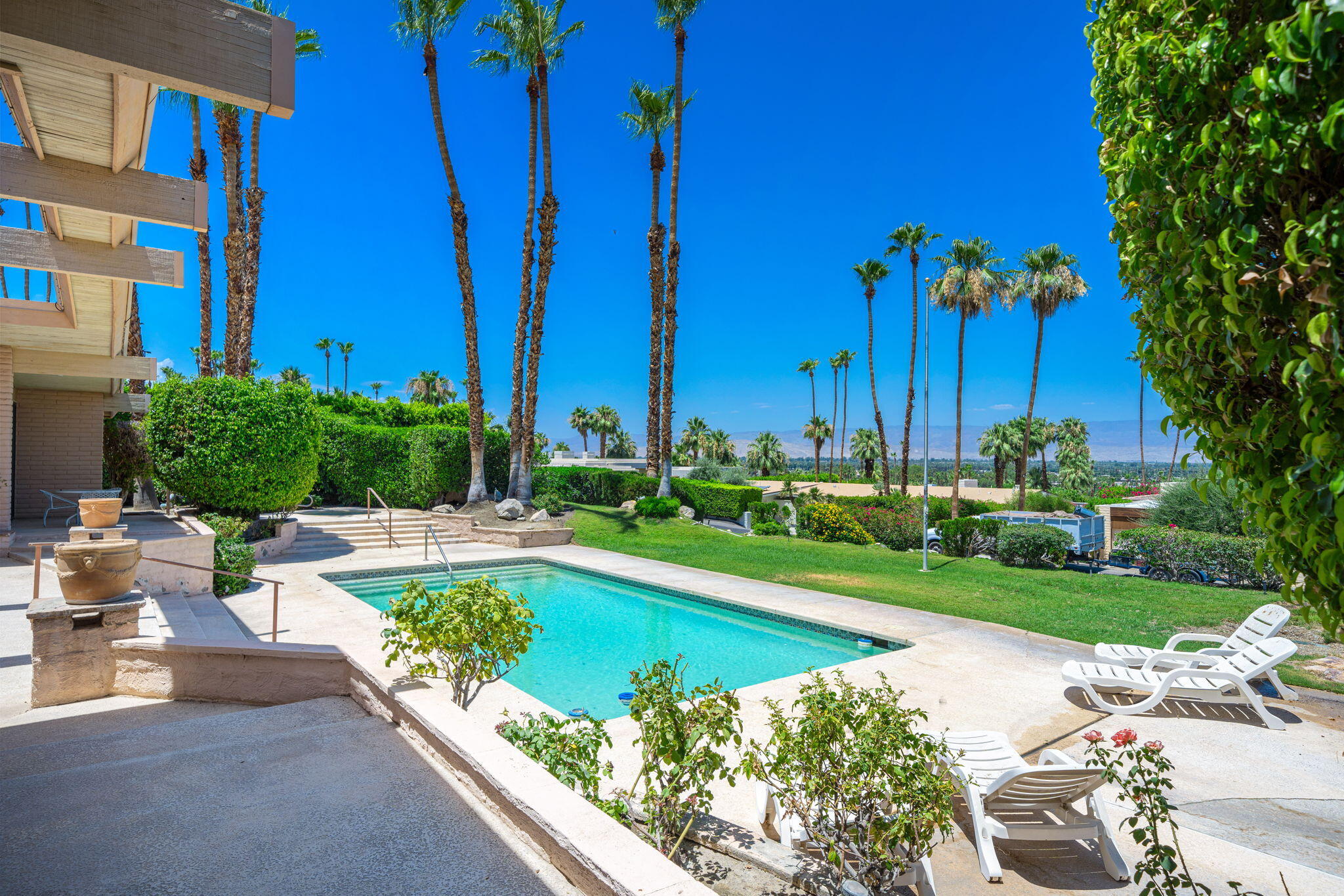 70465 Pecos Road Rancho Mirage, CA 92270 - Photo 25 of 48 a view of a swimming pool with a patio