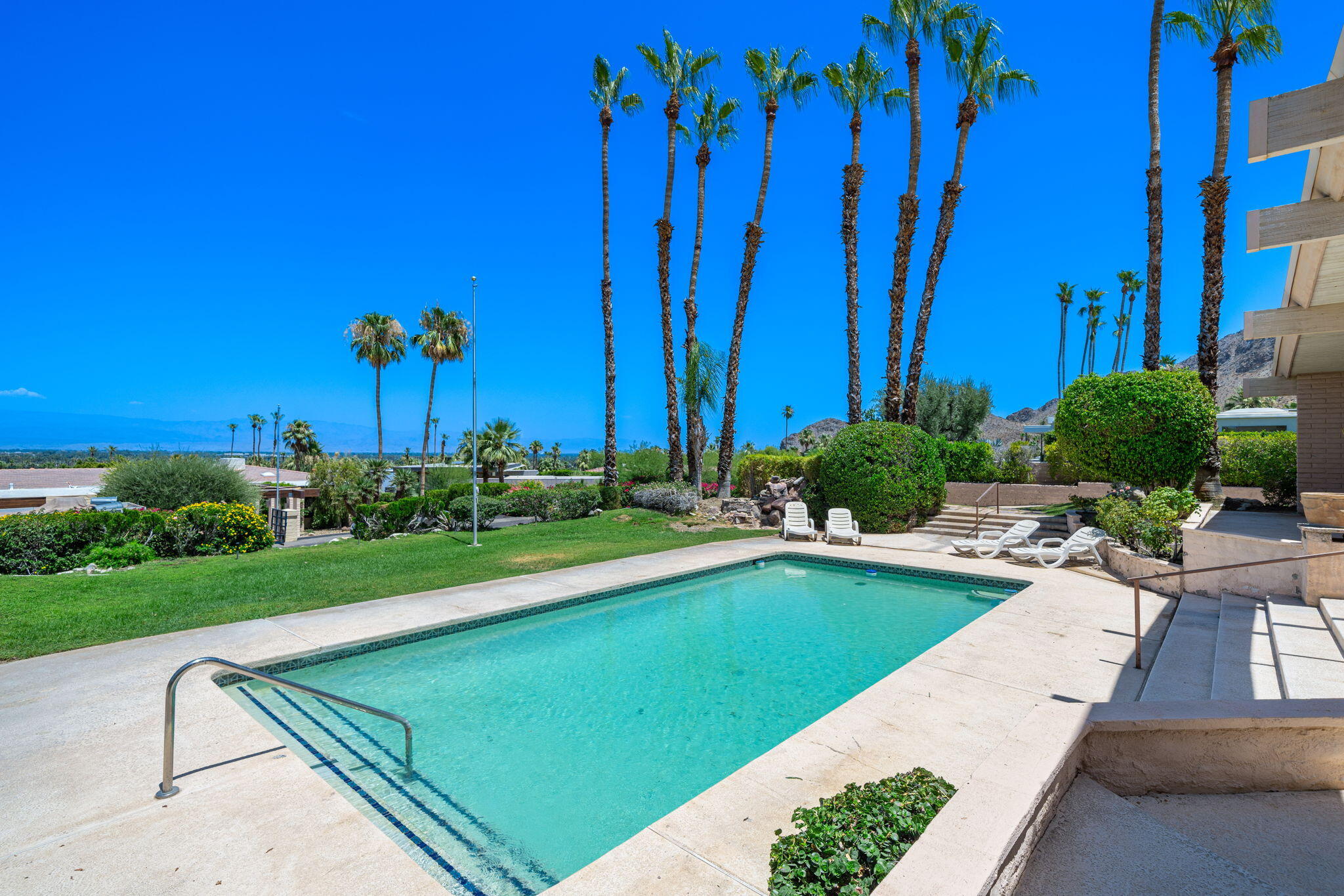 70465 Pecos Road Rancho Mirage, CA 92270 - Photo 27 of 48 a view of swimming pool with outdoor seating and plants