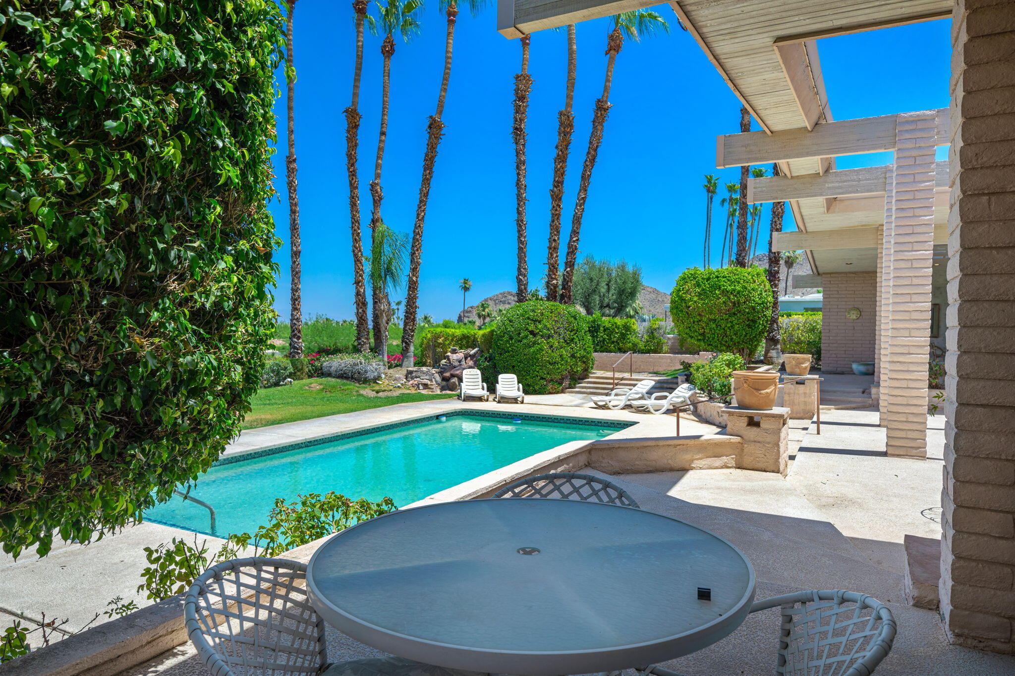 70465 Pecos Road Rancho Mirage, CA 92270 - Photo 28 of 48 a view of a swimming pool with a patio
