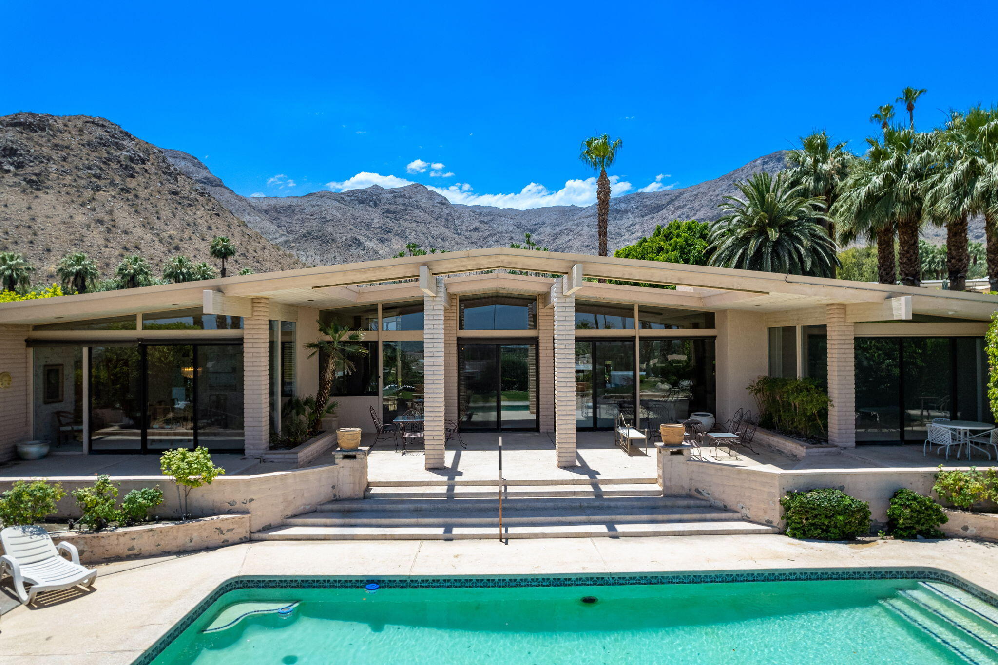 70465 Pecos Road Rancho Mirage, CA 92270 - Photo 5 of 48 front view of a house with a yard balcony