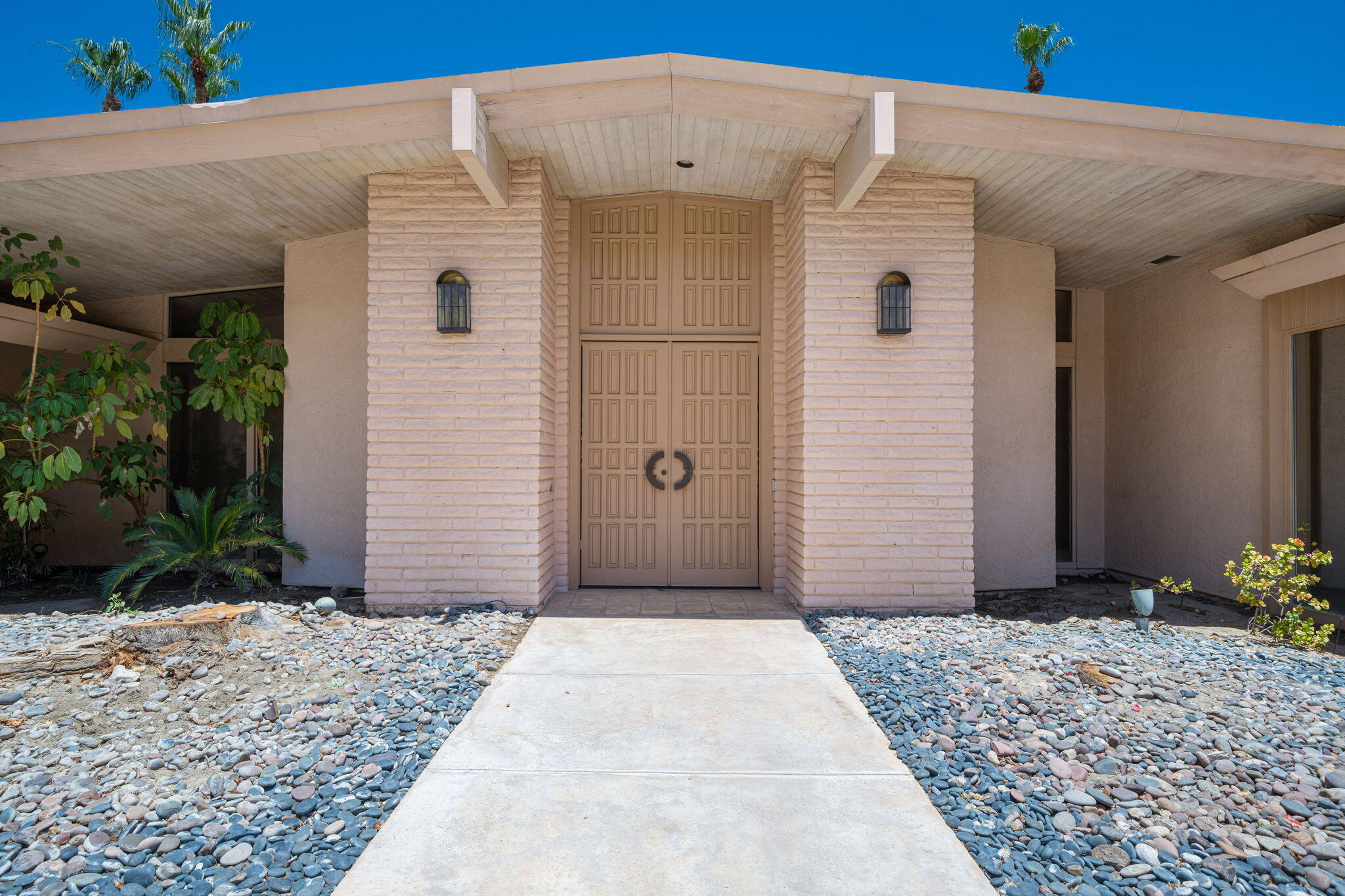 70465 Pecos Road Rancho Mirage, CA 92270 - Photo 9 of 48 a front view of a house with a yard
