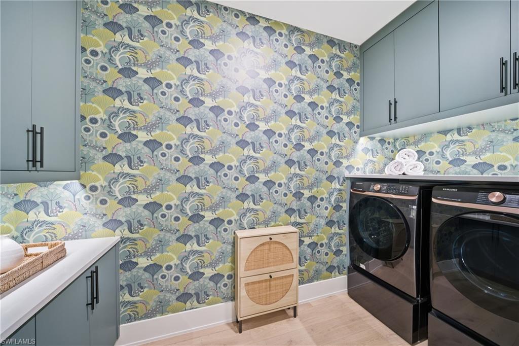 82 9th Street South, Unit 303 Naples, FL 34102 - Photo 18 of 26 a utility room with a sink and a washer dryer