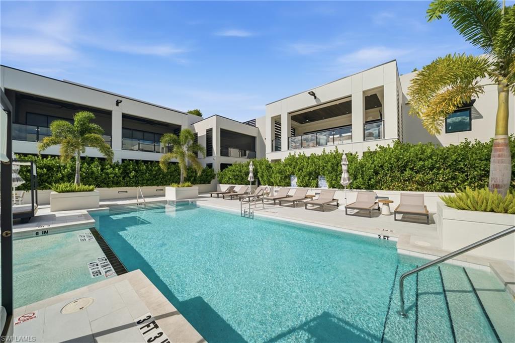 82 9th Street South, Unit 303 Naples, FL 34102 - Photo 19 of 26 a view of a house with a yard porch and sitting area