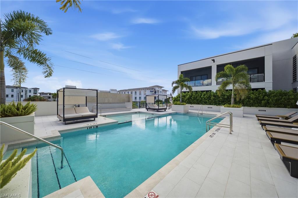 82 9th Street South, Unit 303 Naples, FL 34102 - Photo 20 of 26 a view of a patio with swimming pool