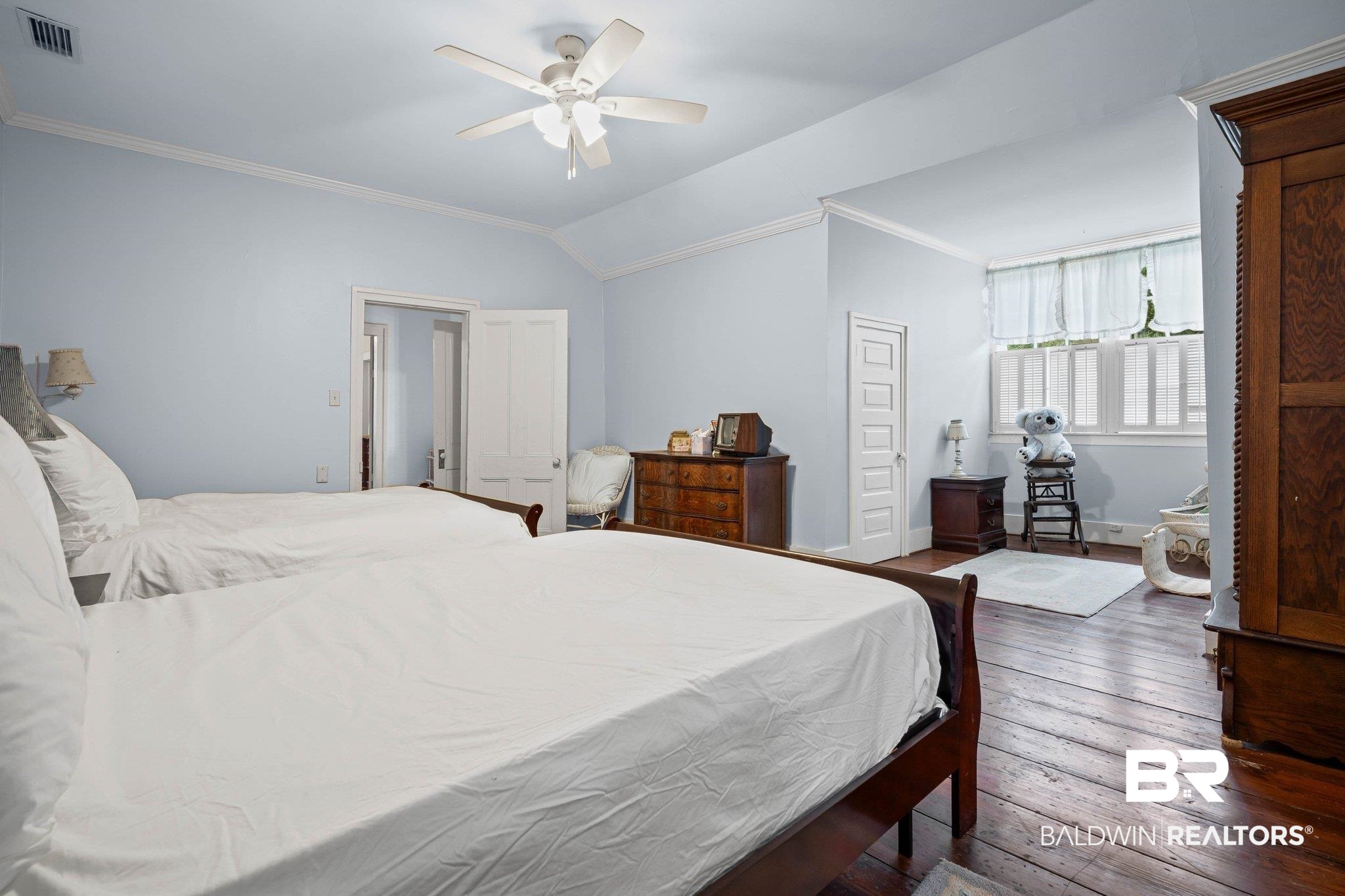 23561 Main Street Fairhope, AL 36532 - Photo 20 of 45 Bedroom featuring ornamental molding, hardwood / wood-style flooring, lofted ceiling, and ceiling fan