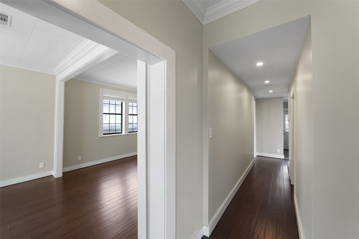 309 Pecore Street Houston, TX 77009 - Photo 17 of 45 a view of a hallway with wooden floor and windows