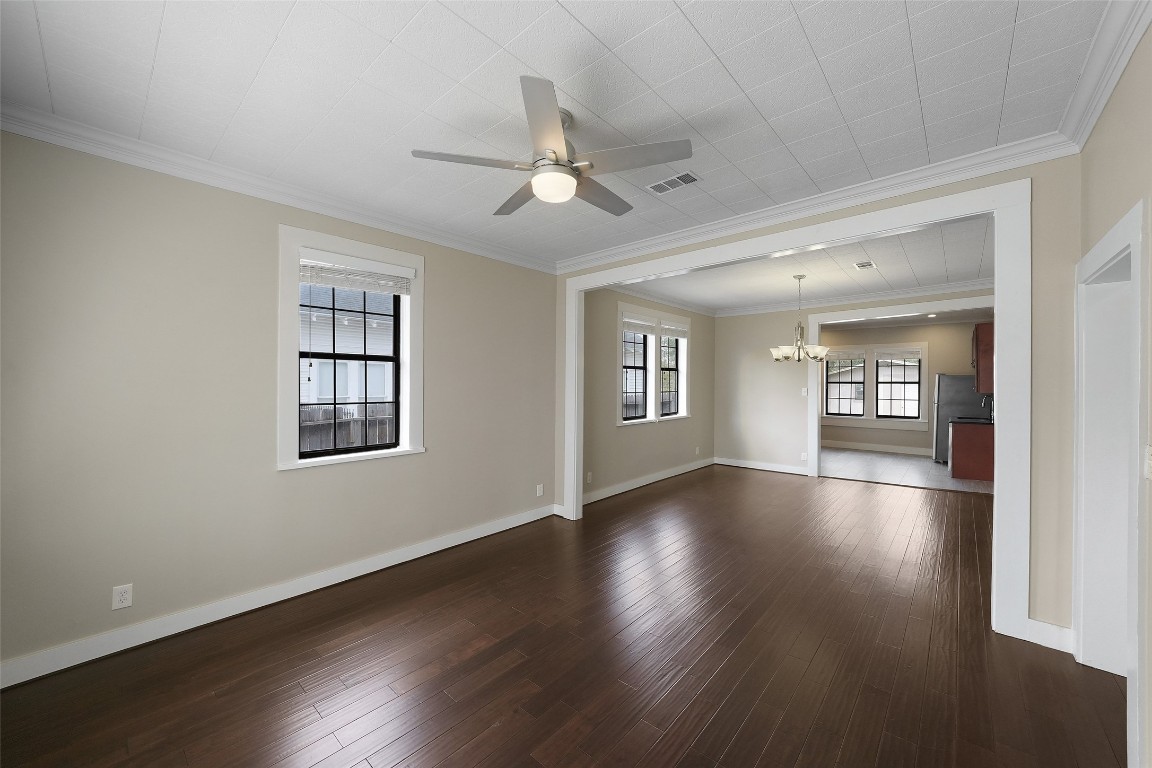 309 Pecore Street Houston, TX 77009 - Photo 18 of 45 a view of an empty room with a window and wooden floor