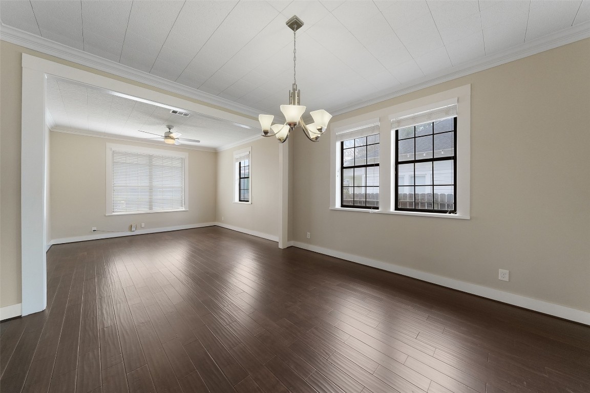 309 Pecore Street Houston, TX 77009 - Photo 22 of 45 a view of an empty room with wooden floor and a window