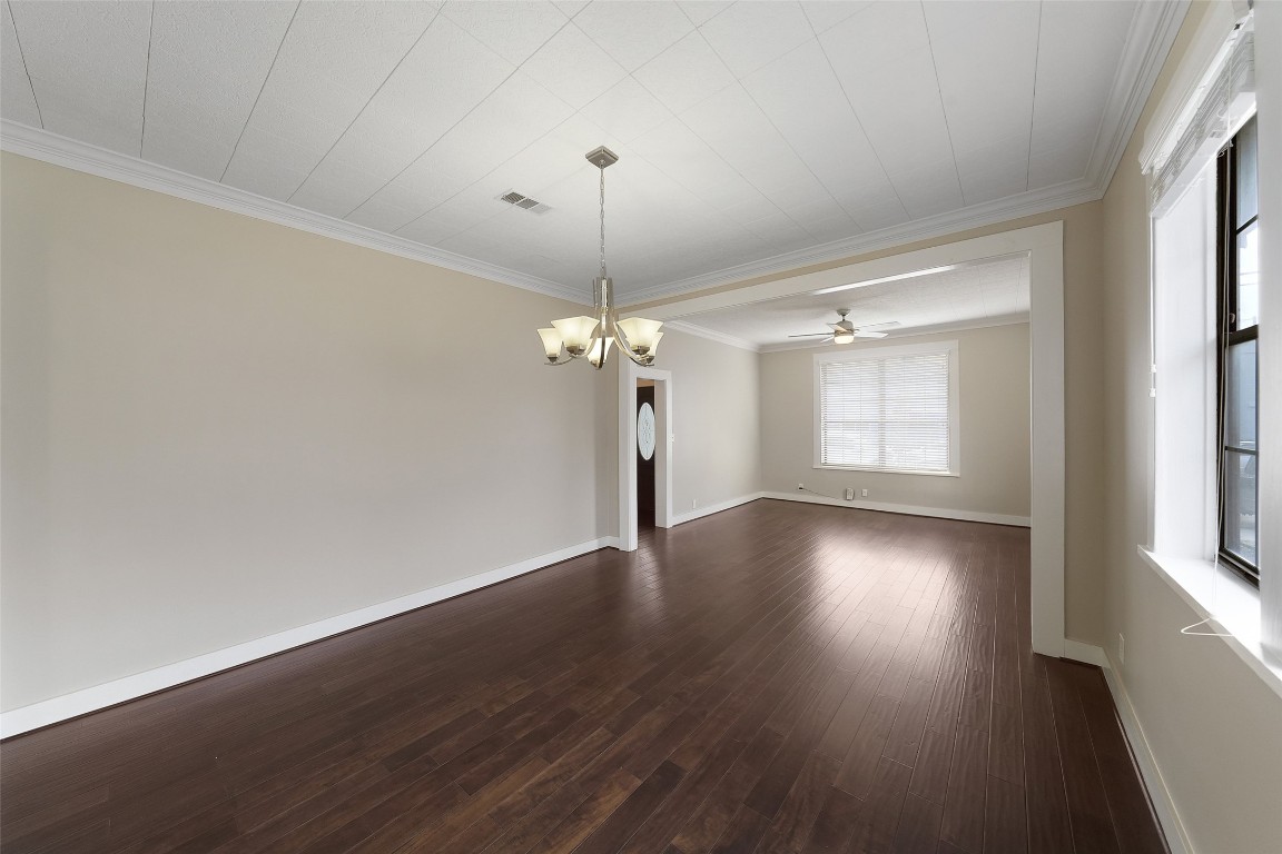 309 Pecore Street Houston, TX 77009 - Photo 26 of 45 a view of a room with wooden floor chandelier and windows