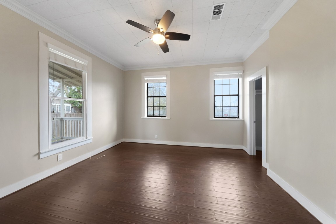 309 Pecore Street Houston, TX 77009 - Photo 27 of 45 a view of an empty room with wooden floor and a window