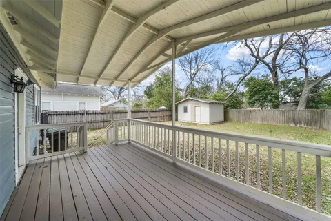 a view of a balcony with wooden floor