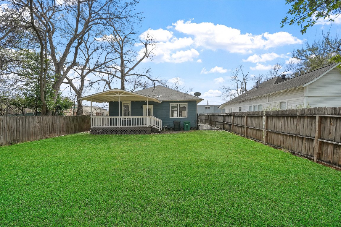 309 Pecore Street Houston, TX 77009 - Photo 36 of 45 a view of a house next to a yard with wooden fence