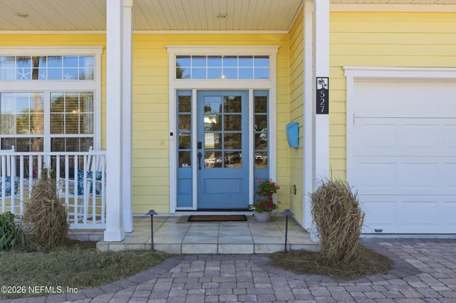 a view of a swimming pool with lounge chairs in patio